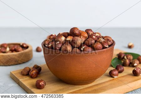 Wooden Bowl Full Of Hazelnuts On Table Background. Healthy Eating Concept. Super Foods.