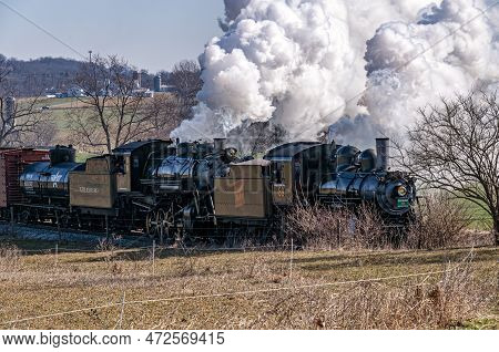 Ronks, Pennsylvania, February 18, 2023 - A View Of A Steam Double Header Freight Train Traveling Thr