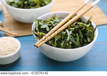 Fresh Laminaria (kelp) Seaweed Served On Light Blue Wooden Table, Closeup