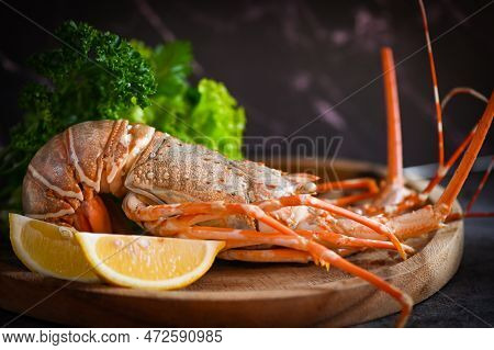 Spiny Lobster Seafood On Wooden Plate, Fresh Lobster Or Rock Lobster With Herb And Spices Lemon Cori