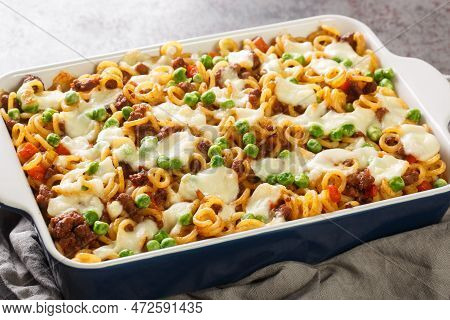Italian Pasta Anelli Baked With Tomatoes, Cheese, Minced Meat, Green Peas, Carrots And Celery Close-