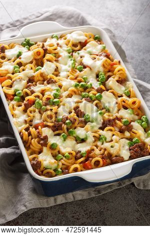 Anelli Pasta Casserole With Tomatoes, Cheese, Minced Meat, Green Peas, Carrots And Celery Close-up I
