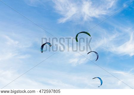 People Practicing Kitesurfing On The Beach Of Los Caños De Meja, Next To The Trafalgar Lighthouse, B