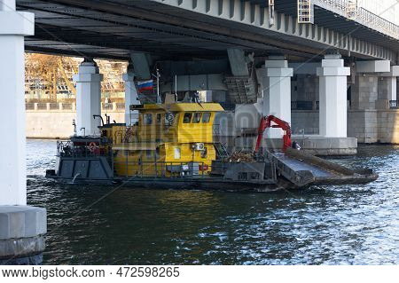 Trash Skimmer Boat Cleaning The Water Surface Of The Moscow River From Garbage In Moscow, Russia. Ri