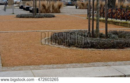 Wire Circular Benches Park Furniture In Winter. Sintered Gravel With The Help Of A Vibrating Roller.