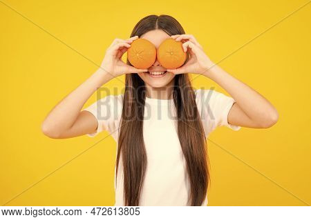 Funny Teenager Portrait. Happy Teenager Girl Hold Grapefruit Orangeisolated On Yellow Background, Ki