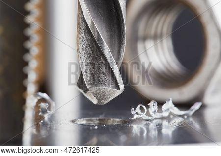 Metal Drill Bit Make Holes In Steel Billet On Industrial Drilling Machine. Metal Work Industry. Mult