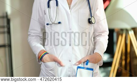 Cropped Image Of Nurse With Rainbow Bracelet On Her Hand. Medical Support For Gender Reassignment Su