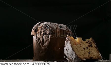 Panettone With Dried Fruits On Black Background, Selective Focus.