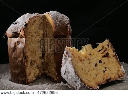 Panettone With Dried Fruits On Black Background, Selective Focus.