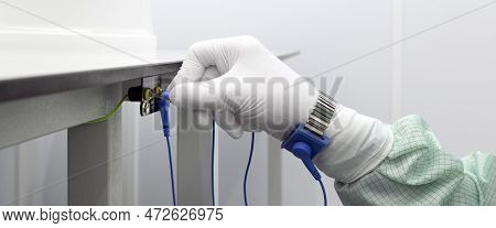 Bracelet On The Hand Of A Man Wearing Esd Cloth And Glove Static Resistance Esd Bracelet Or Ground E