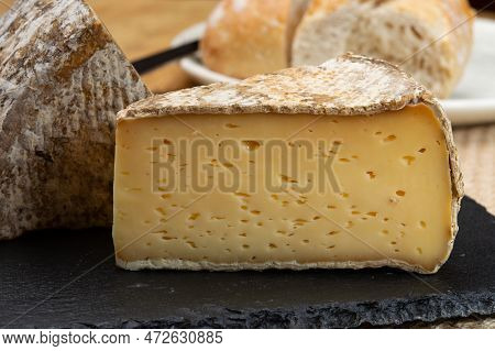 Pieces Of Cheese Tomme De Montagne Or Tomme De Savoie Made From Cow Milk In French Alps Close Up