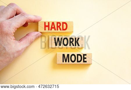 Hard Work Mode Symbol. Concept Words Hard Work Mode On Wooden Block On A Beautiful White Table White
