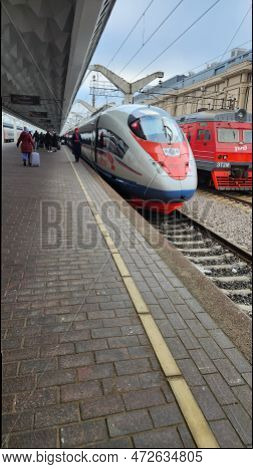 St. Petersburg, Russia - November 21, 2022: Moscow Station. People On Platform Go To Board Sapsan Hi