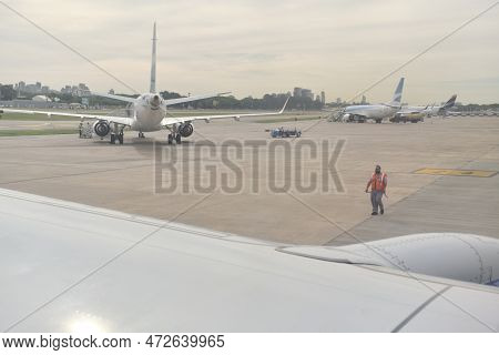 Buenos Aires, Argentina, November 18, 2022: Aviation Marshaller View From A Window Of A Boeing 737-7