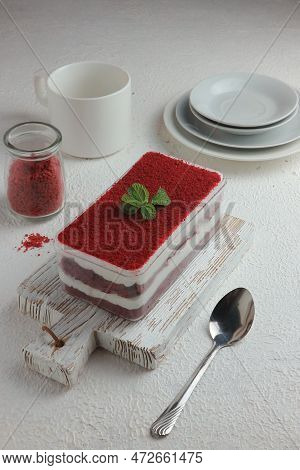 Red Velvet Cake Served On A Wooden Tray