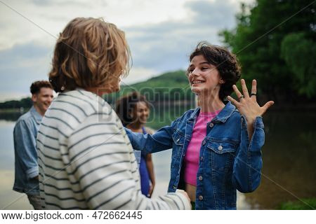 Friends Having Fun Together At Park Lauging And Hugging, Friendship And Lifestyle Concepts