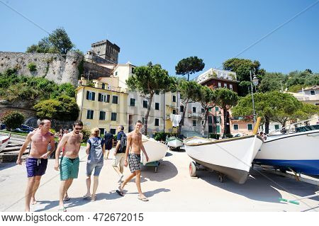 San Terenzo, Italy - May 2011: Shirtless Young Men Walking In The Port Of San Terenzo Village. Gulf 