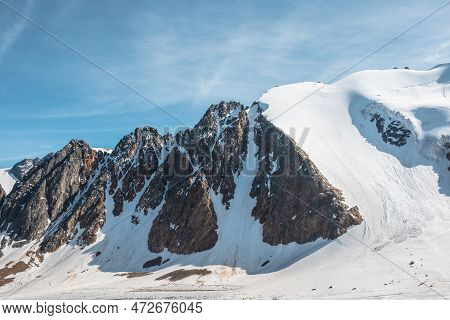 Scenic Mountain Landscape With Glacier Under Sharp Rocks In Sunlight. Awesome Alpine Landscape With 