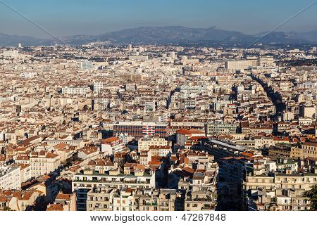 Aerial View Of Marseille City And Mountains In Background, France