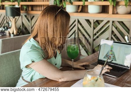 Tver, Russia-august 7, 2022. A Woman With A Laptop Is Studying Human Design. The Concept Of Studying