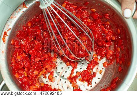 Making Jam And Separating Seeds From Guelder Rose Berries. Guelder Berries Jam