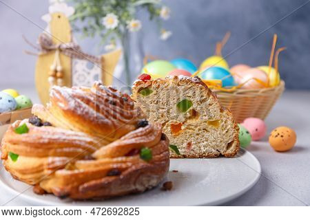 Craffin (cruffin) With Raisins And Candied Fruits. Traditional Easter Bread Kulich And Painted Eggs 