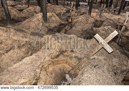 Izium, Ukraine - Mar. 03, 2023: Crosses Are Seen At A Forest Grave Site After An Exhumation In The T