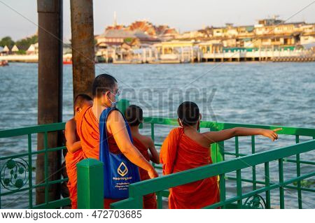 January 3 2023-bangkok Thailand -buddhist Monk Traditionally Dressed In Orange Taking Pictures With 