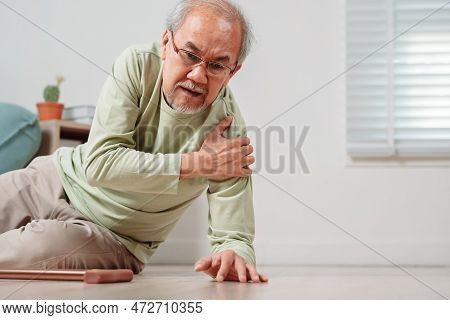 Asian Senior Man Falling On The Ground With Walker In Living Room At Home. Elderly Older Mature Male