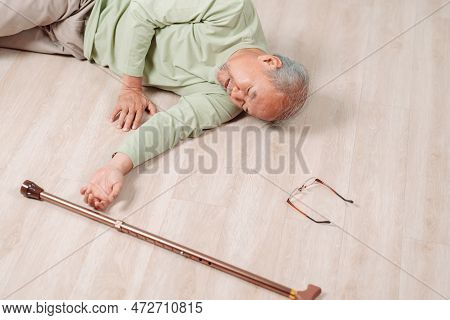 Asian Senior Man Falling On The Ground With Walker In Living Room At Home. Elderly Older Mature Male
