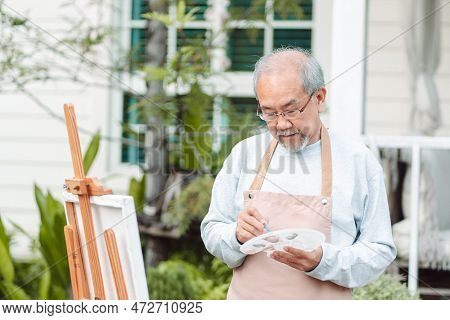 Asian Caregiver Helping Senior Male From Falling On The Ground. Older Elderly Man Patient Having Acc