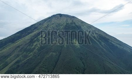Aerial View Of Mount Sindoro In Indonesia With Noise Cloud. High Quality Photo. Selective Focus. Jav