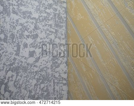 The Combination Of Gray And White Decorative Plaster On The Wall With Gold Striped Plaster. A Beauti