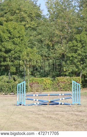 Show Jumping Poles Obstacles, Barriers, Waiting For Riders On Show Jumping Training. Horse Obstacle 