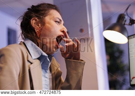 Exhausted Sleepy Entrepreneur Yawning In Startup Office After Working Overhours At Financial Strateg