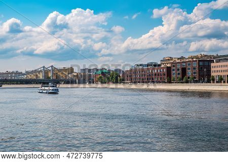 Krymsky Bridge Or Crimean Bridge In Moscow And Cruise Ship Sails On The Moscow River. Steel Suspensi