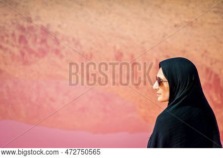 Caucasian Woman Tourist Stand On Maharlu Pink Salt Lake Shore With Reflections. Travel Destination I