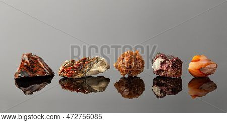 Group Of Stones And Minerals Arranged In A Row Including Vanadinite On Barite, Aragonite Sputnik, Er
