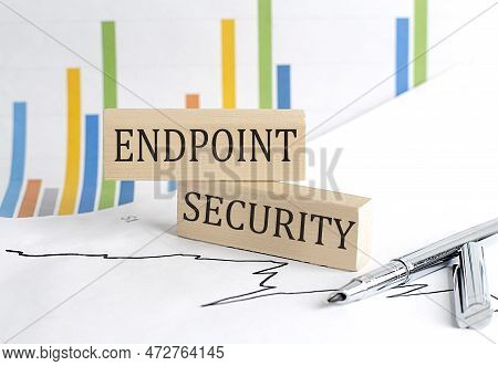 Endpoint Security Text On A Notebook With Pen And Pencil On Grey Background