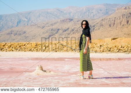 Caucasian Woman Watch Maharlu Pink Salt Lake Panorama In Shiraz, Iran.