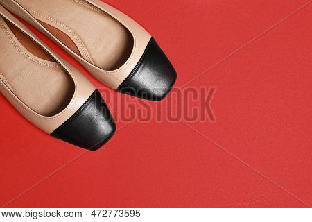Pair Of New Stylish Square Toe Ballet Flats On Red Background, Flat Lay. Space For Text