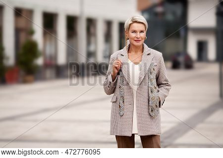 Portrait Of Beautiful Trustable Mature Business Woman With Blonde Short Haircut Fashionably Dressed 