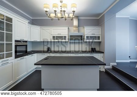 Fashionable Kitchen With Grey Walls And White Furniture, A Kitchen In A Modern Classic Style With Gr