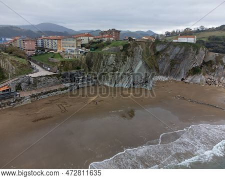 View On Sandy Beach, Rocks And Atlantic Ocean In Zumaia Touristic Ciry, Basque Country, Spain