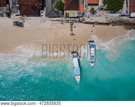 Aerial Shoreline View Of Jungutbatu Beach At Nusa Lembongan With Tourist Speedboat Anchored. One Of 