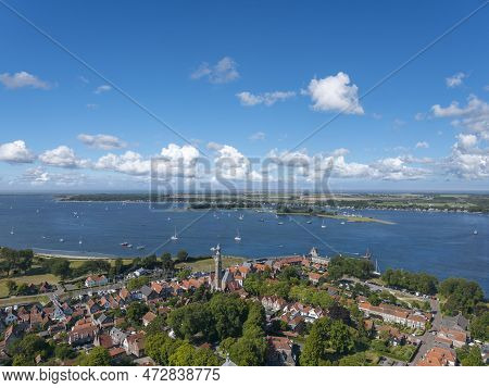 Aerial View Over Veere With The Historic Town Hall. In The Background The Veerse Meer.  Veere Is A C