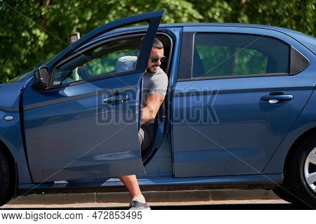 Handsome Man Getting Out Of The Car. Annoyed Man Stopping On Countryside To Look What Is Wrong With 