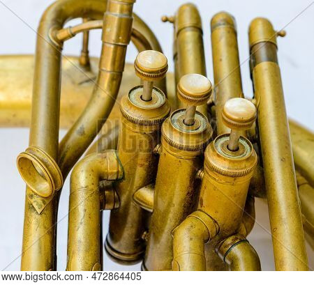 Closeup Of The Brass Valves And Ivory Buttons Of A Sousaphone