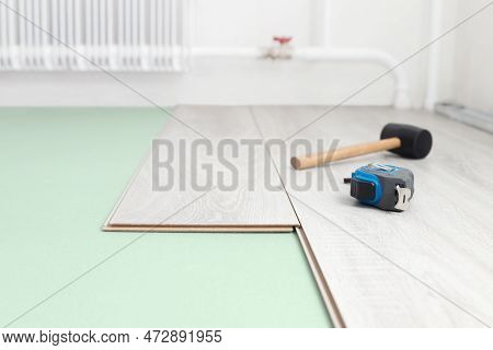 Laying Laminate And Soundproofing On A Concrete Floor. Repair And Decoration Of Premises. Modern Flo